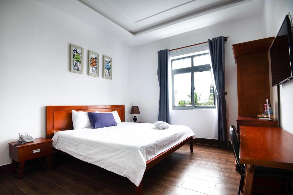 Postel nebo postele na pokoji v ubytování Kim Ngân II hotel