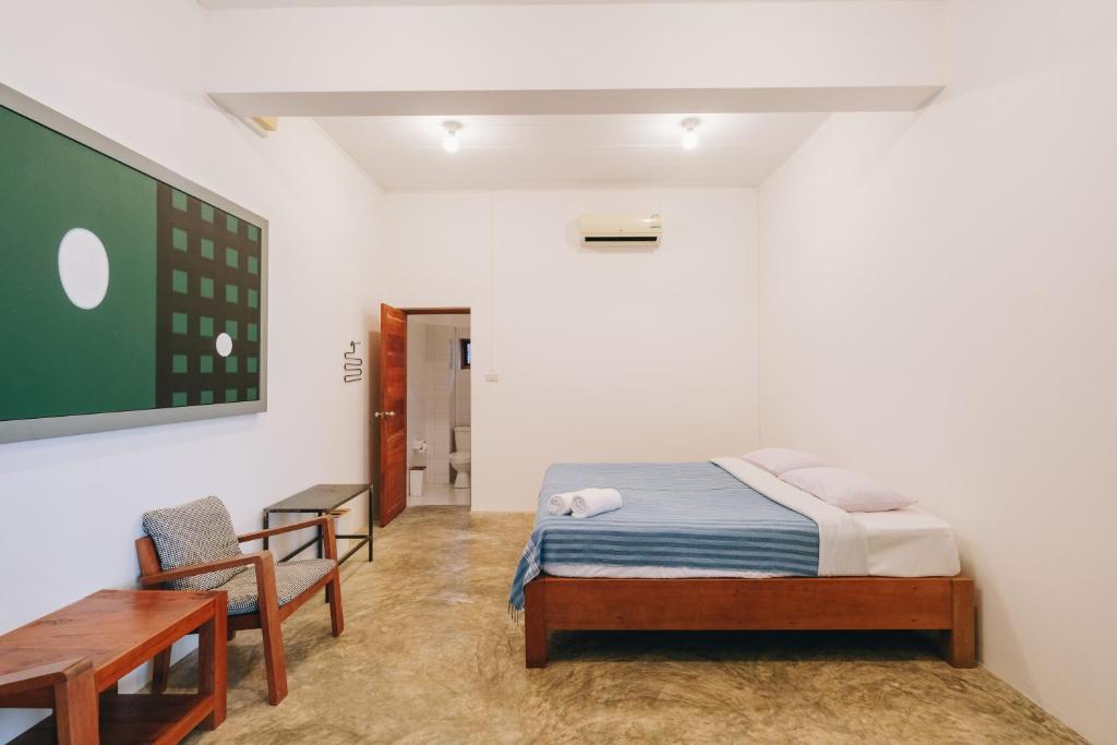 Postel nebo postele na pokoji v ubytování Loogmai Guesthouse Chiang Khan - เรือนแรมลูกไม้ เชียงคาน