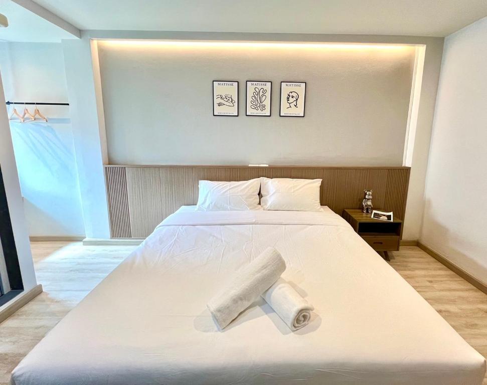 Postel nebo postele na pokoji v ubytování Bedter Hotel Phang Nga