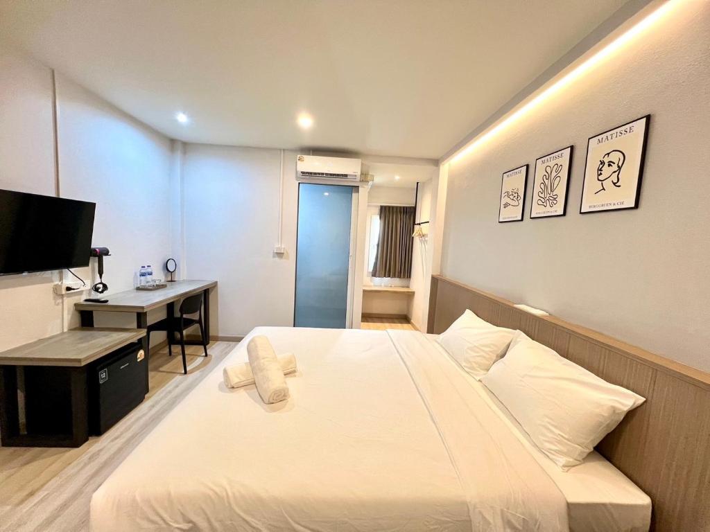 Postel nebo postele na pokoji v ubytování Bedter Hotel Phang Nga
