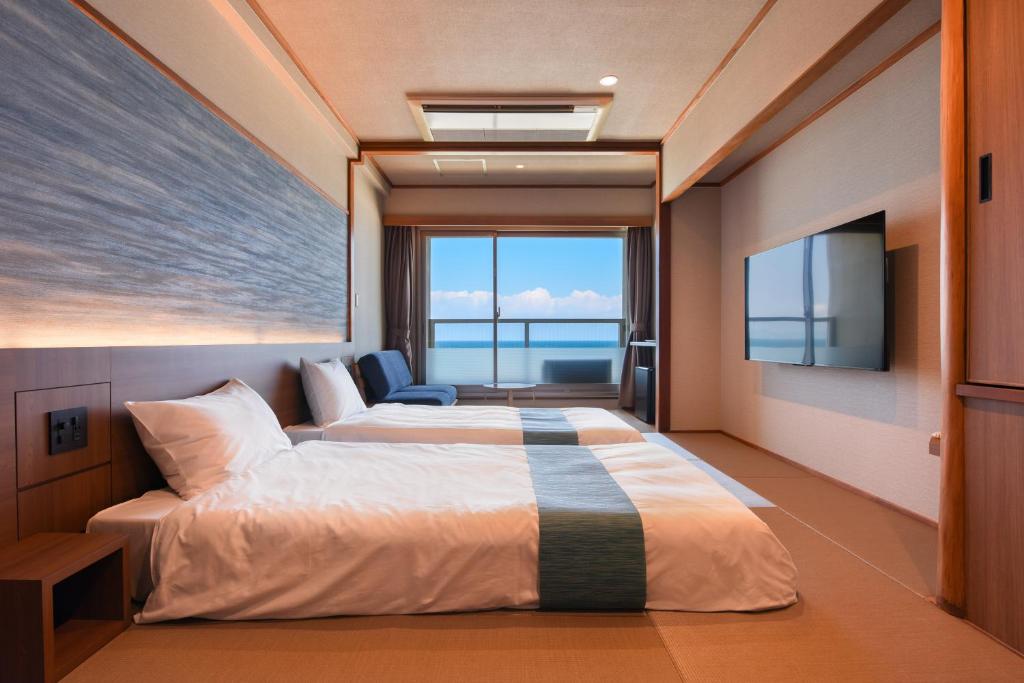Postel nebo postele na pokoji v ubytování Kaike Seaside Hotel