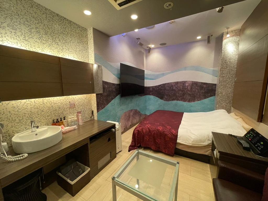 Postel nebo postele na pokoji v ubytování Hotel THE ATTA Adult Only