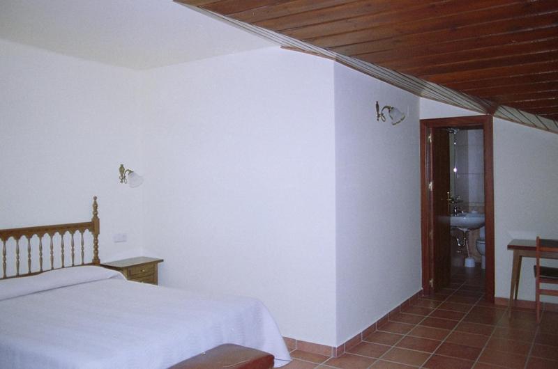 Postel nebo postele na pokoji v ubytování Hostal Fondevila