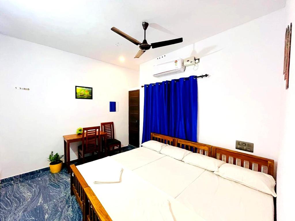 Postel nebo postele na pokoji v ubytování Raelyn's Homestay