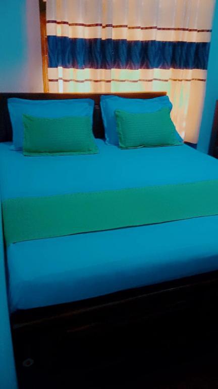 Postel nebo postele na pokoji v ubytování Impress Holiday Home