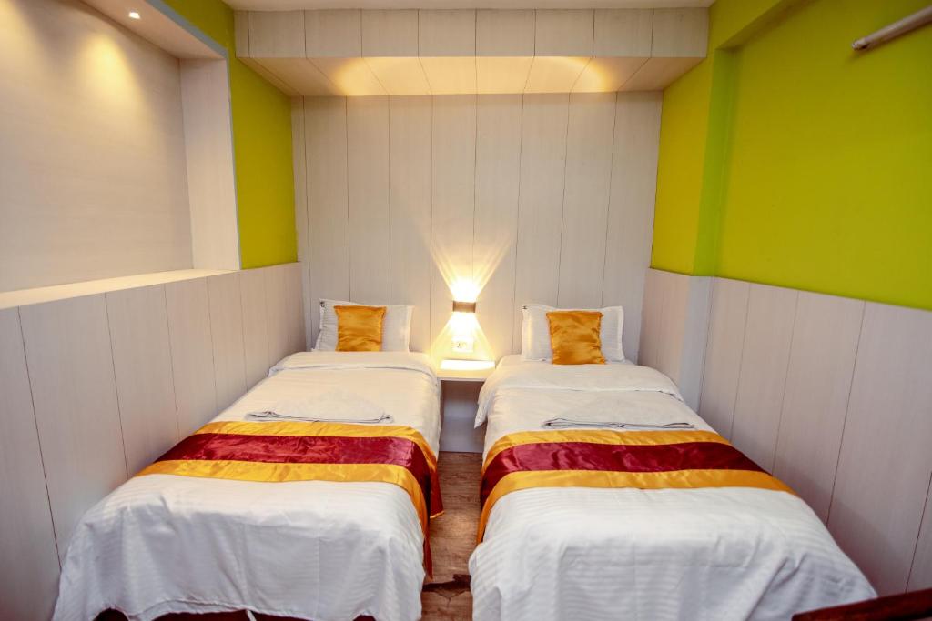 Postel nebo postele na pokoji v ubytování Hotel Pomelo House