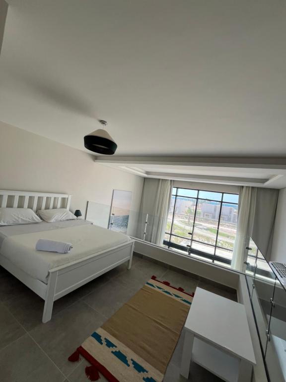 Postel nebo postele na pokoji v ubytování Cozy 2BR Seaview loft in Mesca Somabay
