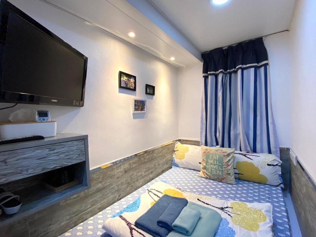Posteľ alebo postele v izbe v ubytovaní Hong Kong Hostel (Tsim Sha Tsui Mansion)