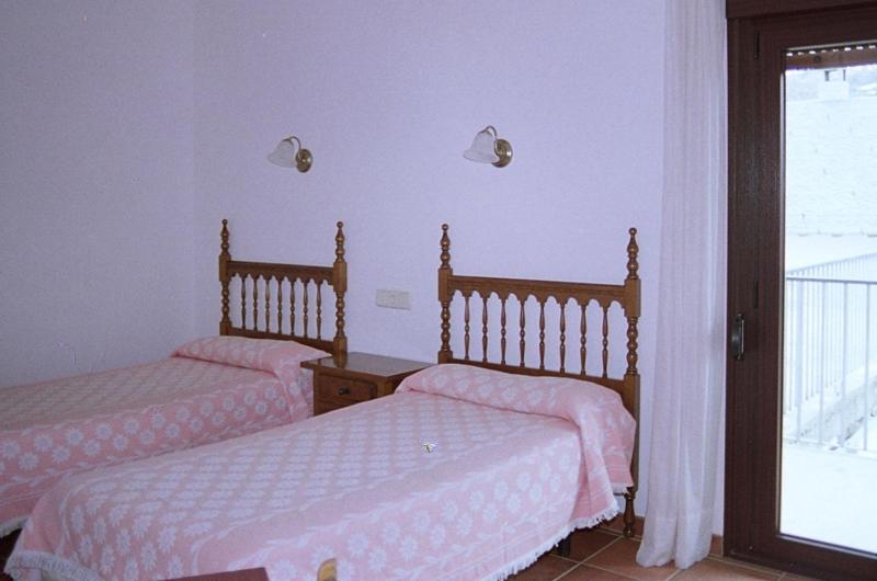 Postel nebo postele na pokoji v ubytování Hostal Fondevila
