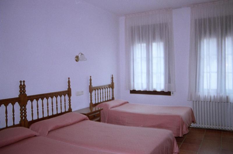 Postel nebo postele na pokoji v ubytování Hostal Fondevila