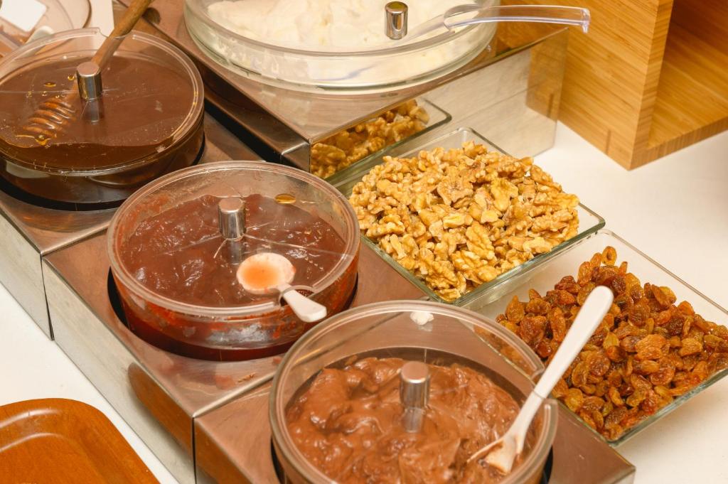 a bunch of different types of food on a counter at Yperia Hotel in Aegiali