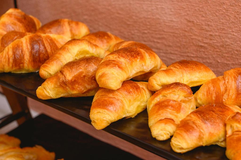 a bunch of croissants are sitting on a tray at Yperia Hotel in Aegiali