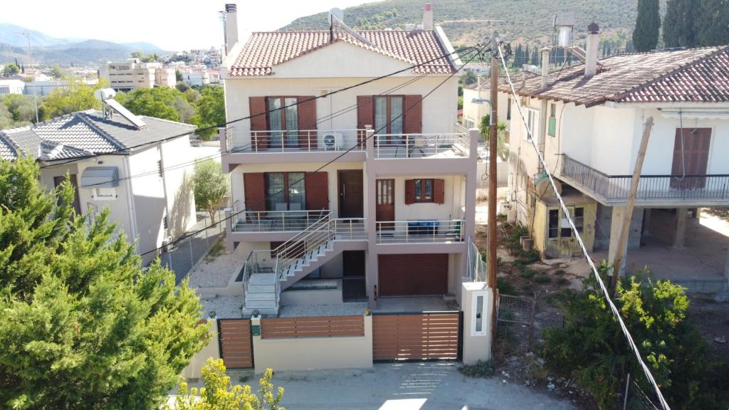 a house with a view of a city at Villa Melydron in Nafplio