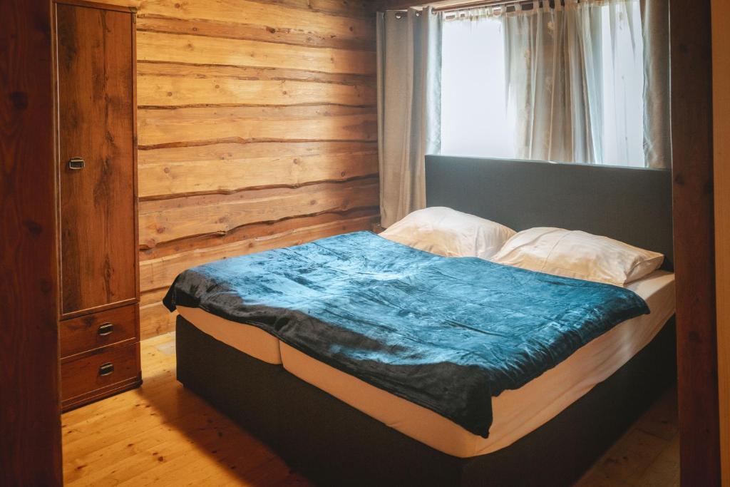 Postel nebo postele na pokoji v ubytování Penzion Sklípek