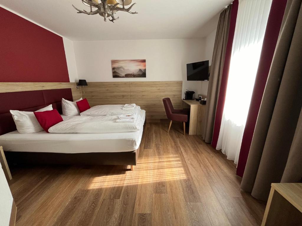Postel nebo postele na pokoji v ubytování Hotel Weißbräu