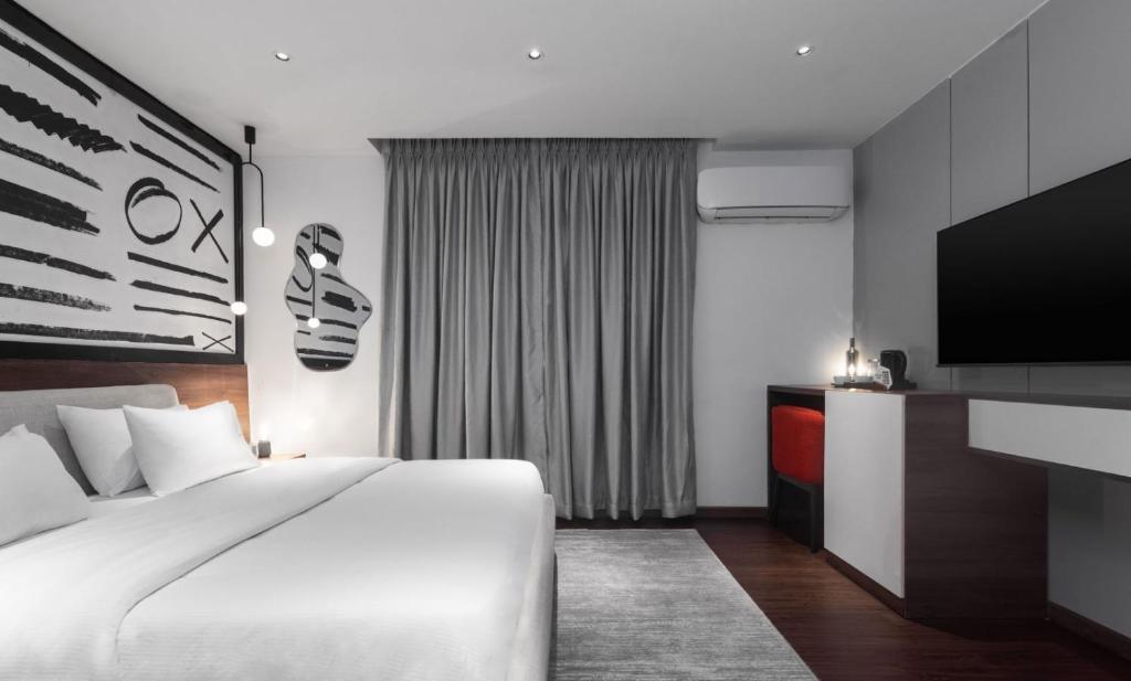 Postel nebo postele na pokoji v ubytování Ivy Lush Hotel
