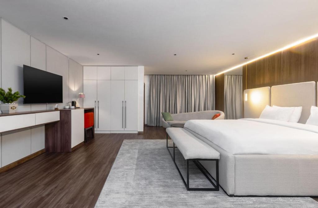 Postel nebo postele na pokoji v ubytování Ivy Lush Hotel
