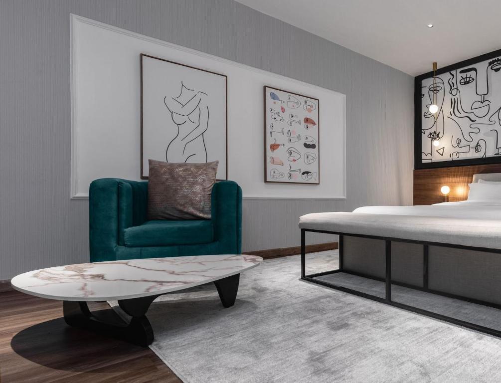 Postel nebo postele na pokoji v ubytování Ivy Lush Hotel