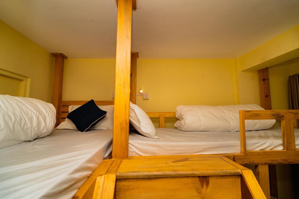 Hotel Aashraya Home - Cama En Habitación Compartida De 4 Camas