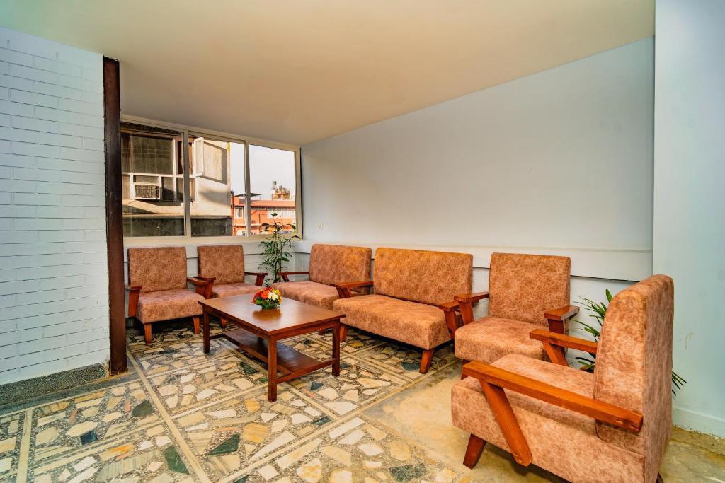 Predel za sedenje v nastanitvi Hotel Aashraya Home