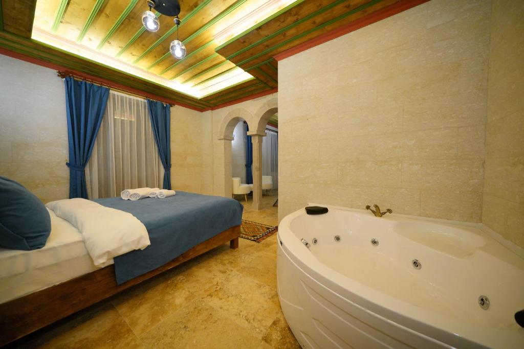 Postel nebo postele na pokoji v ubytování Mayda Cappadocia