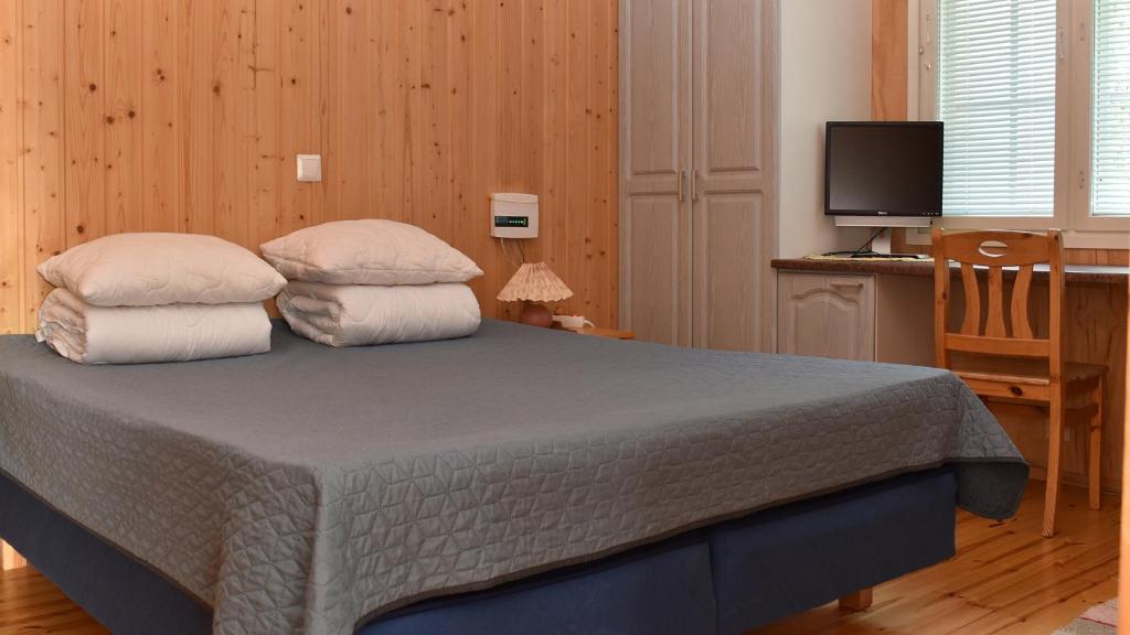 Postel nebo postele na pokoji v ubytování Villa North Karelia by offerhut 25