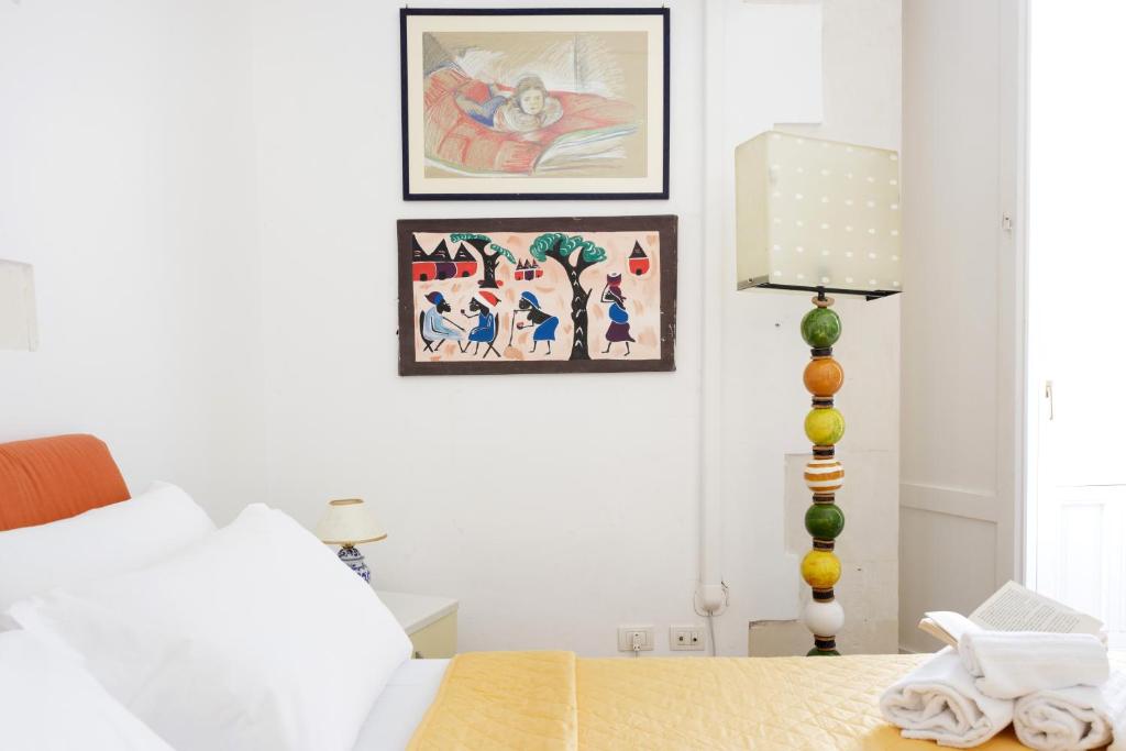 Postel nebo postele na pokoji v ubytování Camera con bagno privato vista mare Ortigia