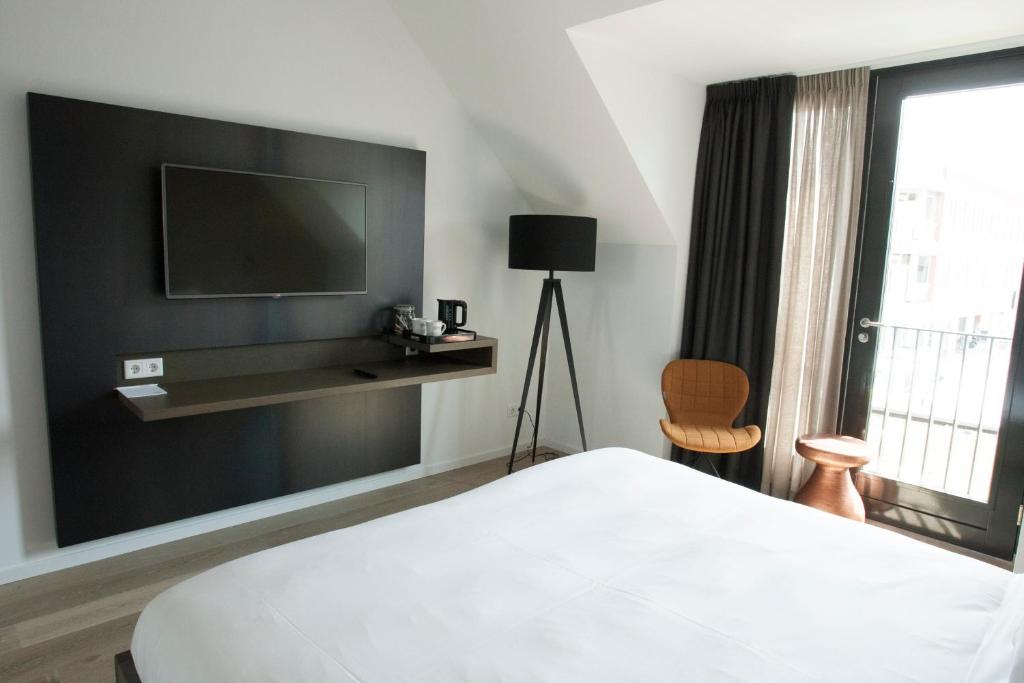 Postel nebo postele na pokoji v ubytování Hotel Katoen