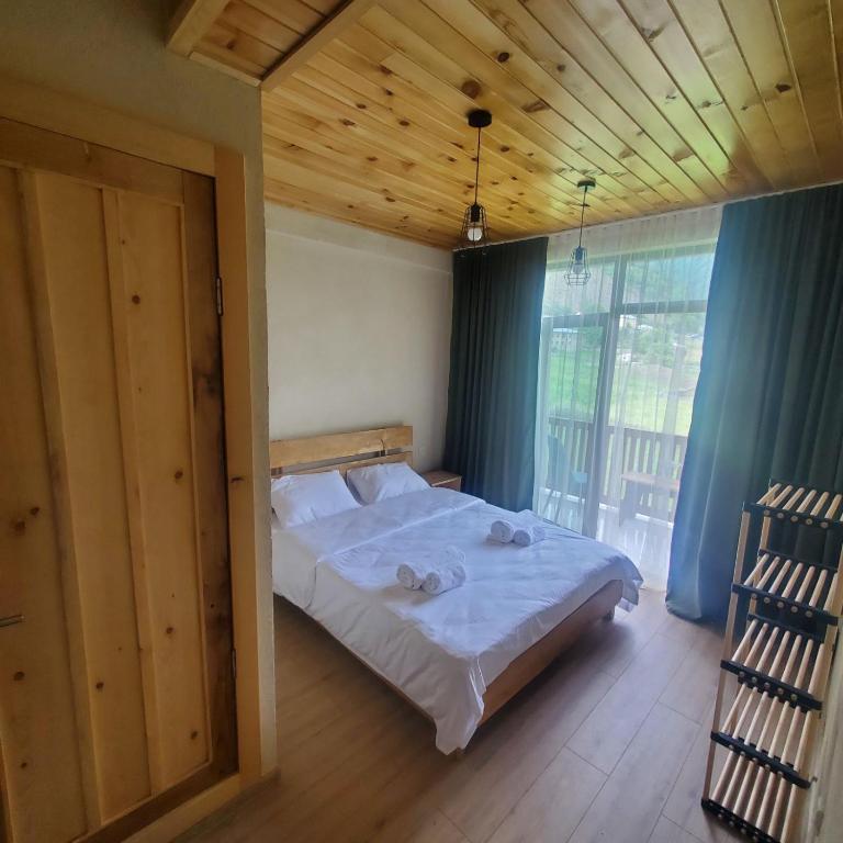 Postel nebo postele na pokoji v ubytování Eco Garden Svaneti