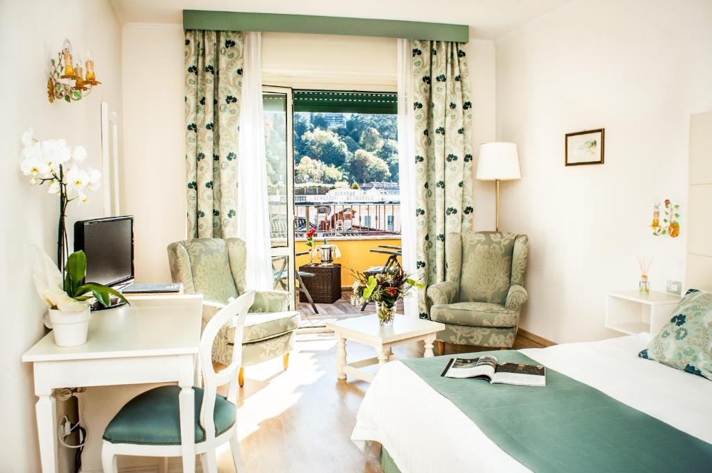 TV a/nebo společenská místnost v ubytování Hotel Du Lac & SPA