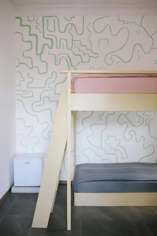 Postel nebo postele na pokoji v ubytování Buna Guest House