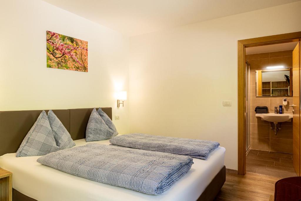 Postel nebo postele na pokoji v ubytování B&B Hotel Sonneck