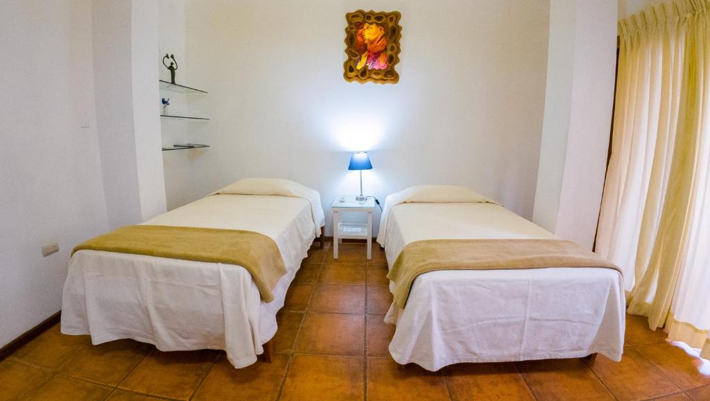 Postel nebo postele na pokoji v ubytování La Casa de Marita