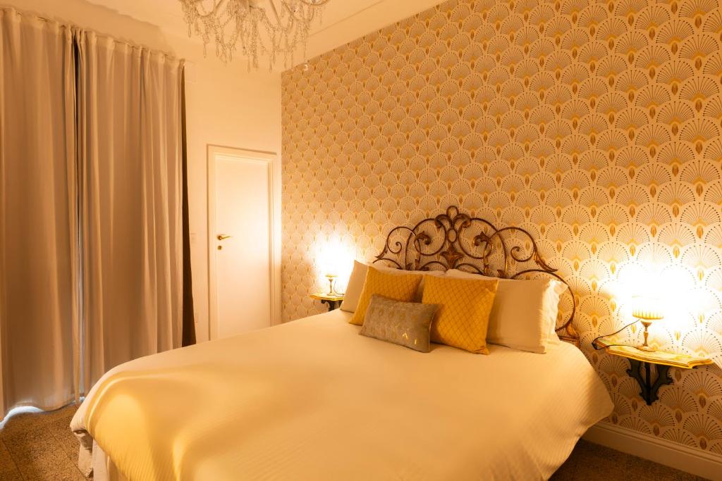 Postel nebo postele na pokoji v ubytování Casa dei Liuti Luxury GuestHouse