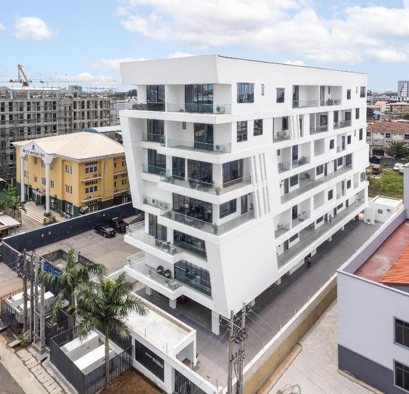 an aerial view of a white apartment building at Four Two, Rock Drive in Lekki Phase 1