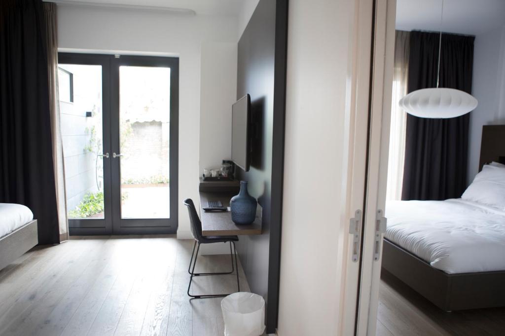 Postel nebo postele na pokoji v ubytování Hotel Katoen