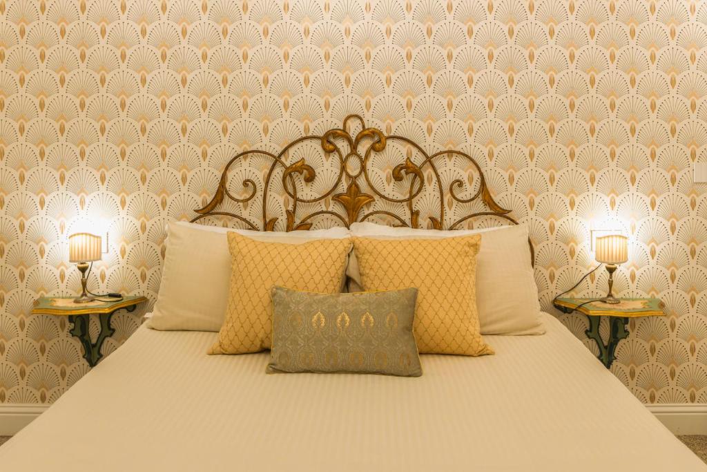 Postel nebo postele na pokoji v ubytování Casa dei Liuti Luxury GuestHouse