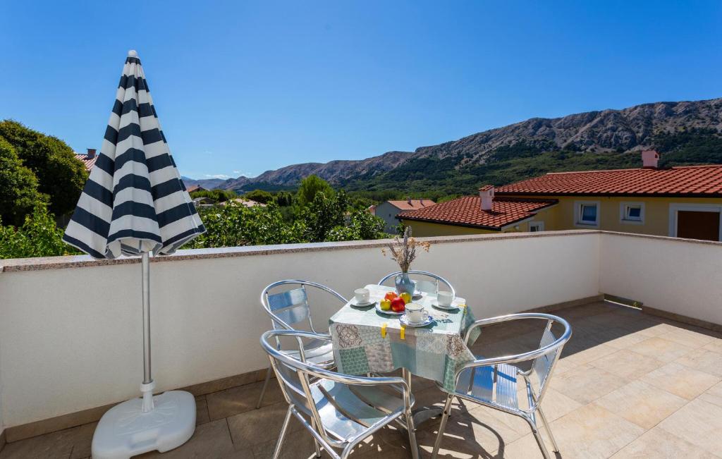 a table and chairs on a balcony with a view at 1 Bedroom Lovely Apartment In Jurandvor in Jurandvor