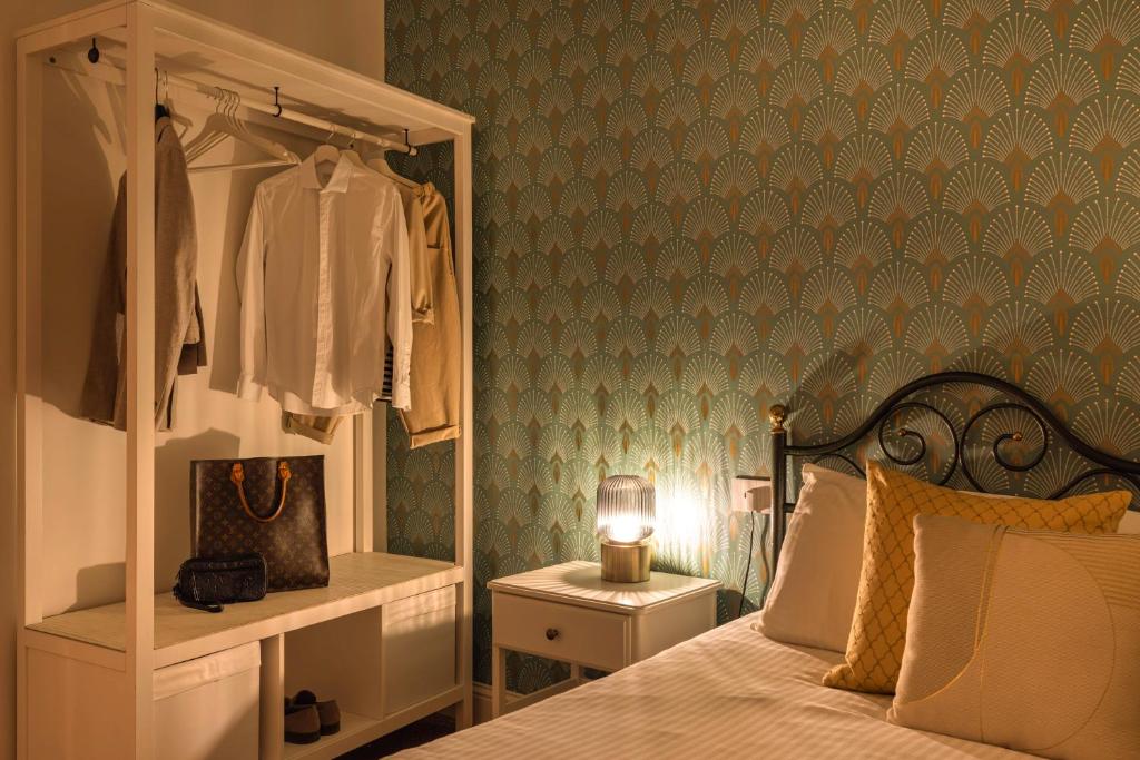Postel nebo postele na pokoji v ubytování Casa dei Liuti Luxury GuestHouse