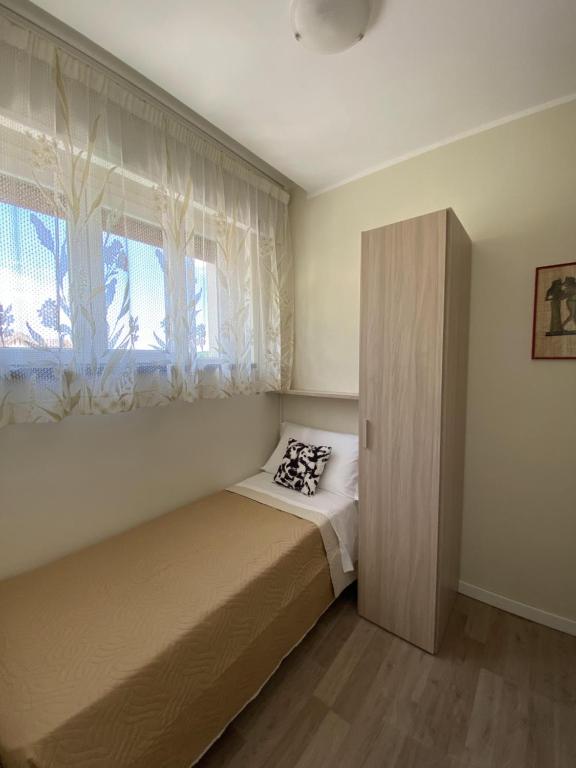 Postel nebo postele na pokoji v ubytování Albergo Lodrino