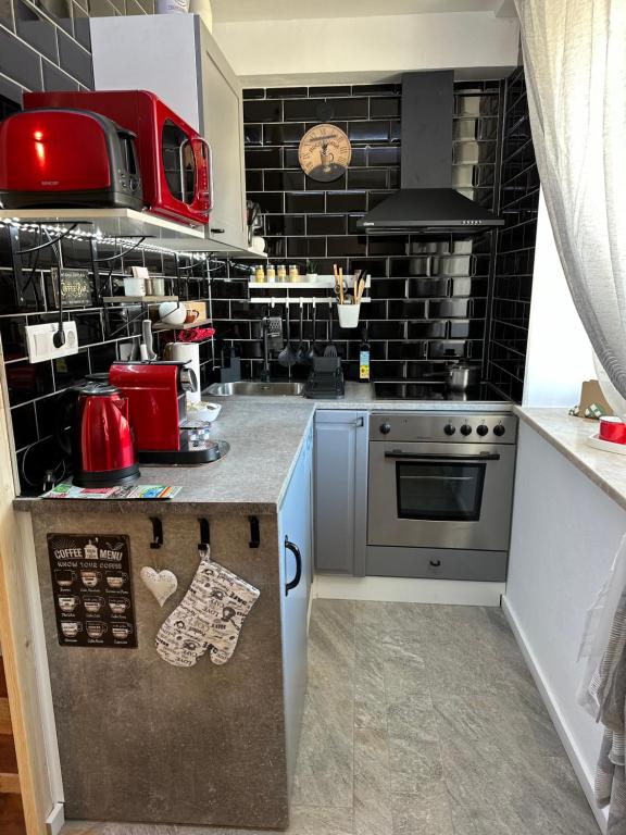 a kitchen with a stove and a counter top at Sweet Home in Klagenfurt