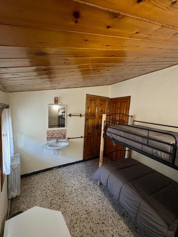 Postel nebo postele na pokoji v ubytování L Esquella Restaurante hostal