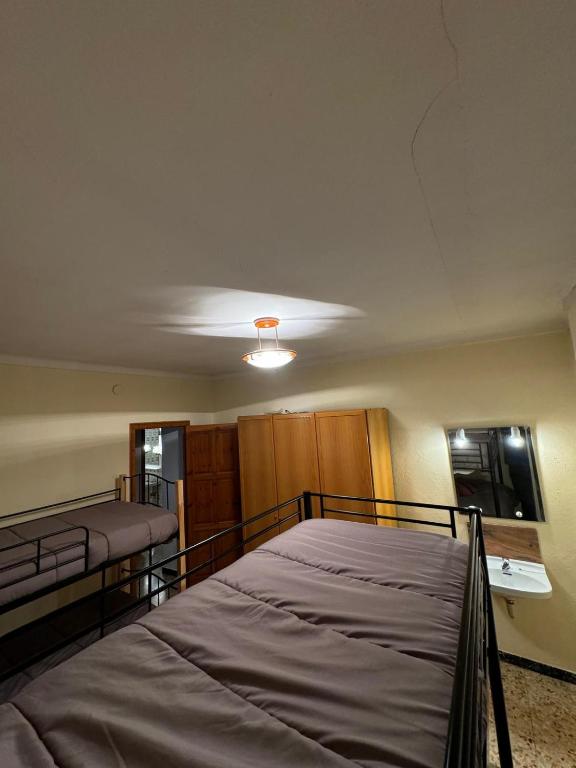 Postel nebo postele na pokoji v ubytování L Esquella Restaurante hostal