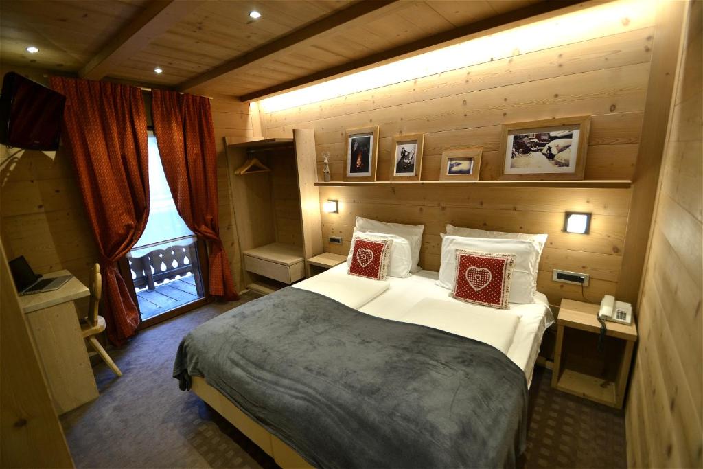 Posteľ alebo postele v izbe v ubytovaní Hotel Piccolo Tibet