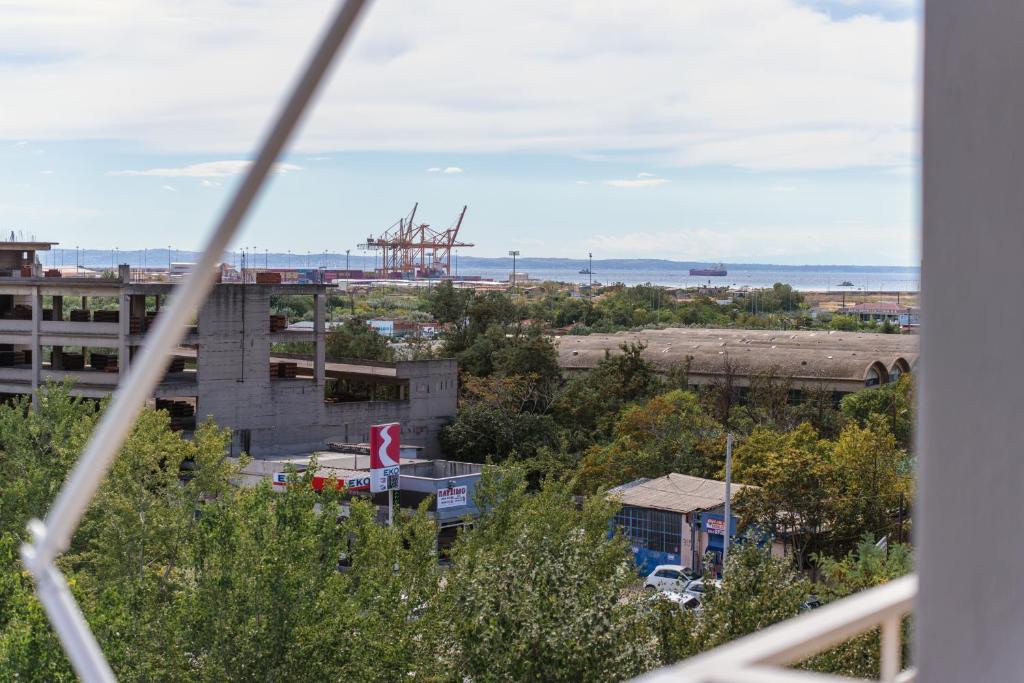 a view of a city from a window at La Bella Casa Thessaloniki in Thessaloniki