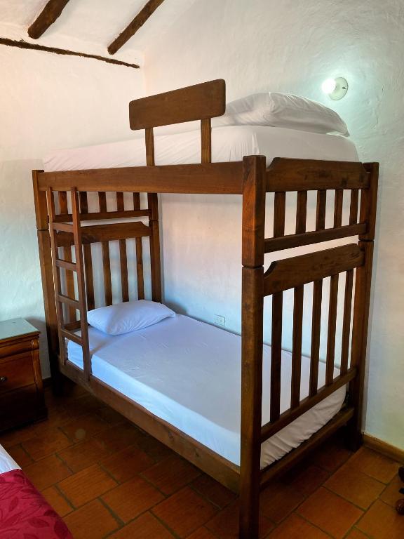Postel nebo postele na pokoji v ubytování Hostal Villa San Rafael