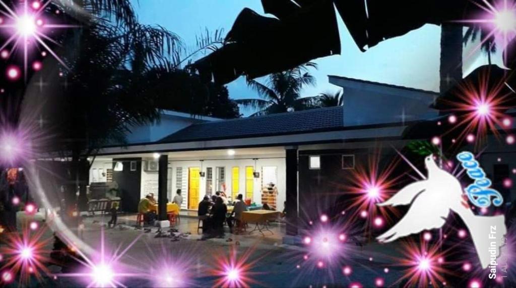 a house with people standing in front of it at HOMESTAY KAPAR KLANG Homestay Balqis in Kapar