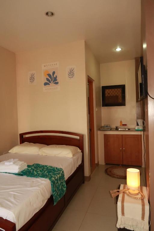 Postel nebo postele na pokoji v ubytování Jo-Cris Apartelle
