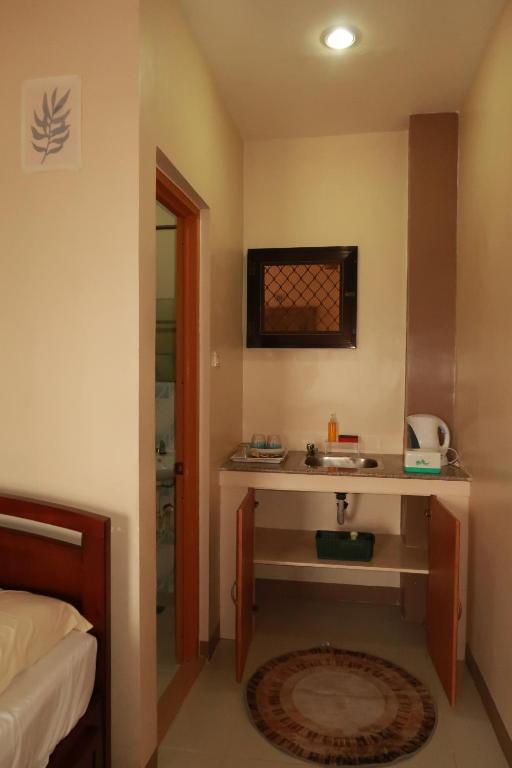 Kuchyň nebo kuchyňský kout v ubytování Jo-Cris Apartelle