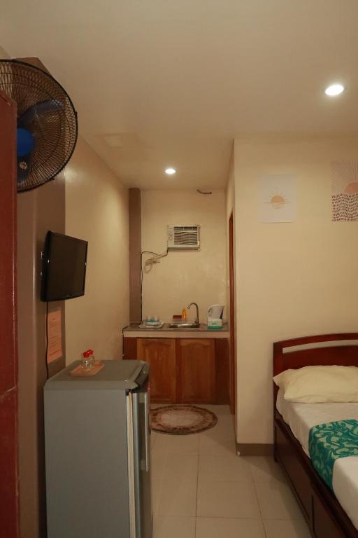 Postel nebo postele na pokoji v ubytování Jo-Cris Apartelle